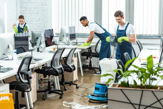 CleanPro Plus commercial cleaning team maintaining an office floor